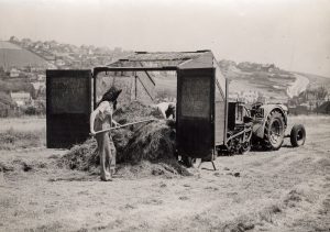 Women's Land Army loading or emptying a tractor trailer