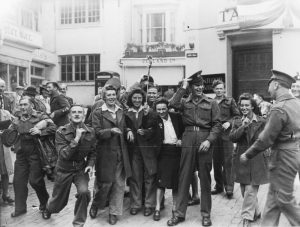 Celebrating Victory over Japan (VJ) day in East Street, Brighton, 18 August 1945